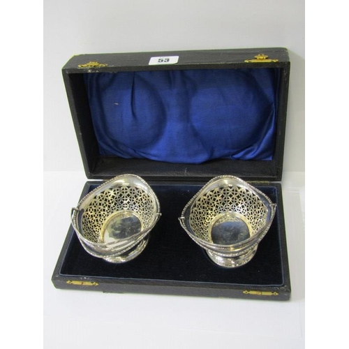 53 - CASED PAIR OF SILVER SWEETMEAT DISHES, pair of pierced body swing handled sweetmeat dishes, Birmingh... 