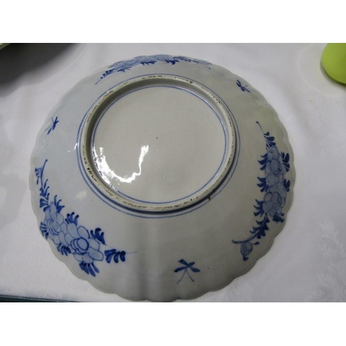 24 - ORIENTAL CERAMICS, underglaze blue scallop edge 30cm charger decorated with peony blossoms