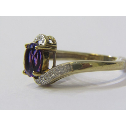 175 - AMETHYST & DIAMOND RING, 9ct yellow gold ring set central oval amethyst  with diamond shoulders in a... 