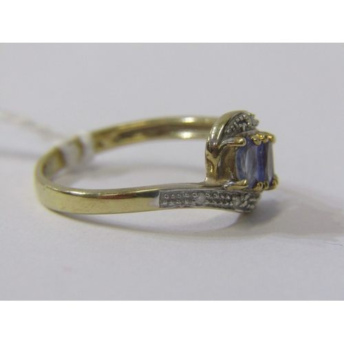 180 - TANZANITE & DIAMOND RING, 9ct yellow gold ring set 3 tanzanite's with diamond shoulders in a cross o... 