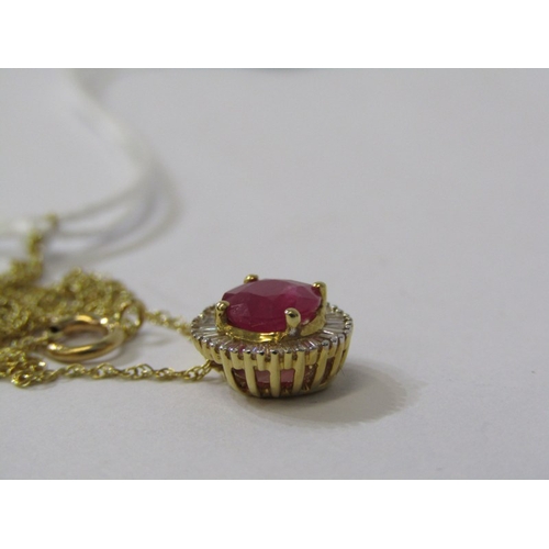 209 - RUBY & DIAMOND PENDANT ON CHAIN, a large circular ruby surrounded by a cluster of baguette diamonds ... 