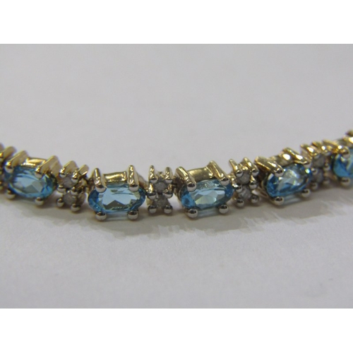 230 - IMPRESSIVE BLUE TOPAZ & DIAMOND BRACELET, set in 9ct yellow gold, set 25 blue topaz interspersed by ... 