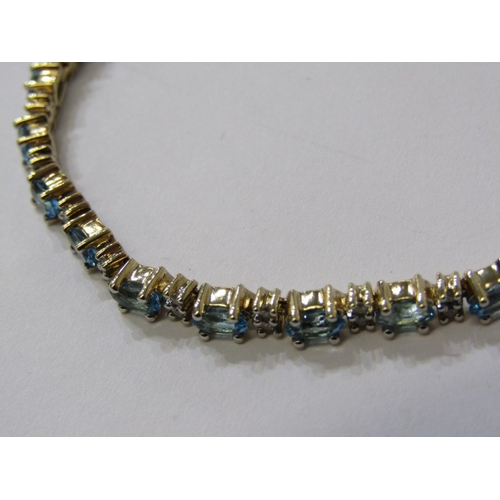 230 - IMPRESSIVE BLUE TOPAZ & DIAMOND BRACELET, set in 9ct yellow gold, set 25 blue topaz interspersed by ... 