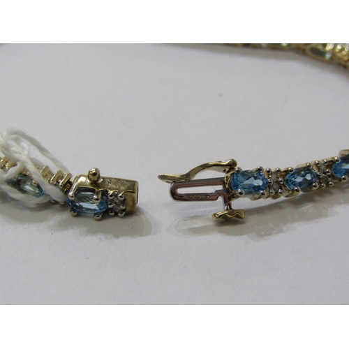 230 - IMPRESSIVE BLUE TOPAZ & DIAMOND BRACELET, set in 9ct yellow gold, set 25 blue topaz interspersed by ... 