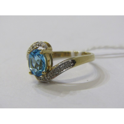 233 - TOPAZ & DIAMOND RING, 9ct yellow gold ring set with a large oval topaz with diamond shoulders in a c... 