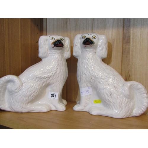 371 - STAFFORDSHIRE POTTERY, pair of seated spaniels