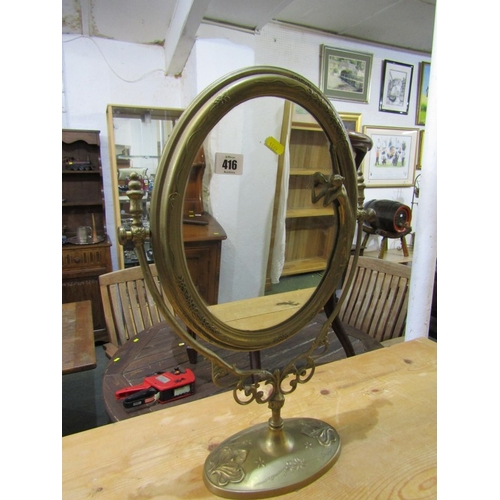 416 - BRASS PEDESTAL MIRROR, Art Nouveau style oval mirror on stand, 50cm height