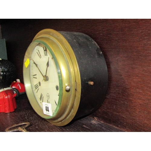 44 - SHIP'S BULKHEAD CLOCK, circular brass faced clock