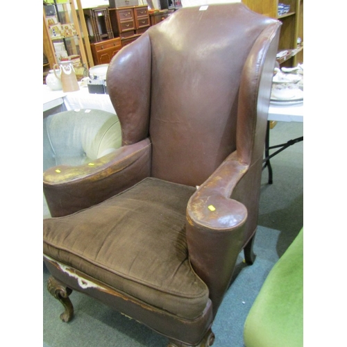 454 - VINTAGE LEATHER ARMCHAIR, vintage brown leather wingback armchair, with brown upholstered cushion, o... 