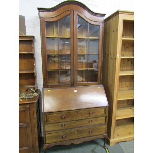 491 - BUREAU/BOOKCASE, mahogany veneered domed top bureau/bookcase, glazed doors above, bureau base fitted... 