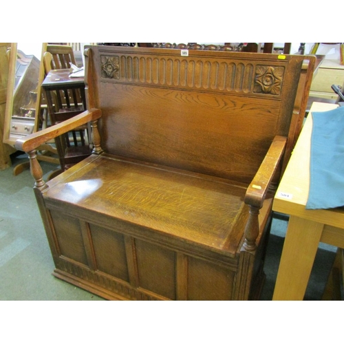 505 - OAK MONKS BENCH, with carved linen fold decoration to back with rising cupboard base and 4 [anel fro... 