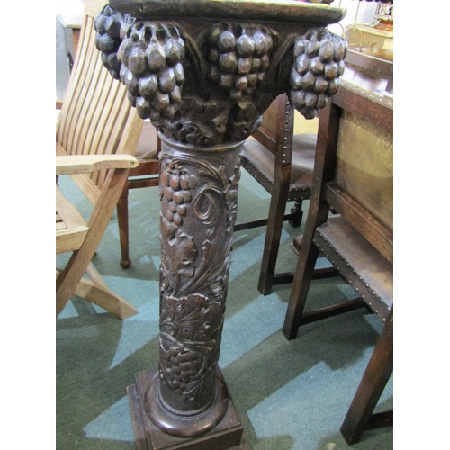 507 - 19th CENTURY CARVED PILLAR, heavily carved oak pillar, with grape and foliate decoration on square f... 