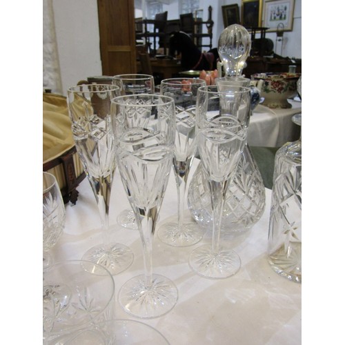 90 - CUT GLASS TABLEWARE, including wines, champagne flutes, 2 decanters, etc