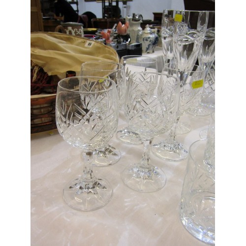 90 - CUT GLASS TABLEWARE, including wines, champagne flutes, 2 decanters, etc