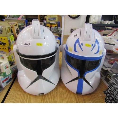 224 - STAR WARS, pair of Storm Trooper helmets together with a laser gun