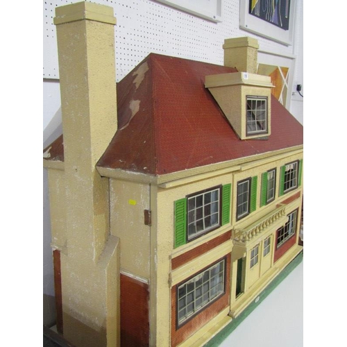 218 - A 1920's TRIANG DOLLS HOUSE, an impressive dolls house by Triang and retailed by Hamleys, 113cm widt... 