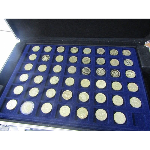 22 - ROUND POUNDS;  a collection of £1 coins x 87, from the United Kingdom, on trays in an aluminium coin... 