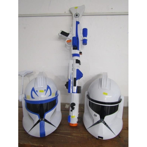 224 - STAR WARS, pair of Storm Trooper helmets together with a laser gun