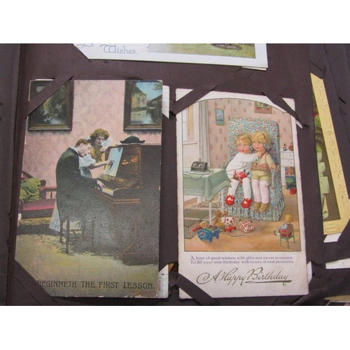 254 - EDWARDIAN POSTCARDS, brown album containing approximately 115 postcards, including a large selection... 