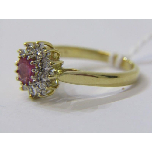 277 - RUBY & DIAMOND CLUSTER RING, 18ct yellow gold ring, set a central oval ruby surrounded by a cluster ... 