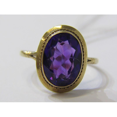 281A - AMETHYST RING, 9ct yellow gold ring, set a large oval cushion cut amethsyt, size U