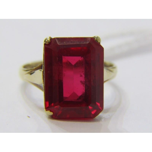 282A - RED STONE DRESS RING, 9ct yellow gold ring, set an emerald cut red stone, size I