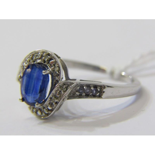 286 - SAPPHIRE CLUSTER RING, 9ct white gold ring, set a large oval sapphire in a cluster style setting, si... 