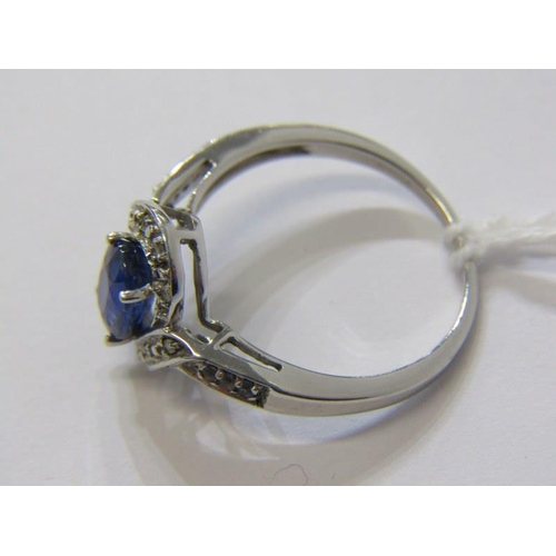 286 - SAPPHIRE CLUSTER RING, 9ct white gold ring, set a large oval sapphire in a cluster style setting, si... 