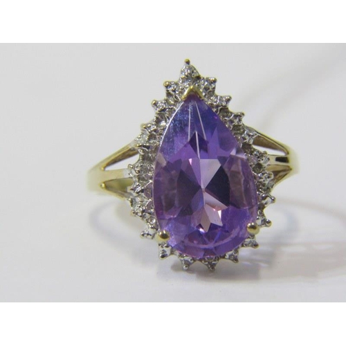 303 - AMETHYST CLUSTER RING, 9ct yellow gold ring, with a pear shaped amethyst in a cluster of diamonds, s... 