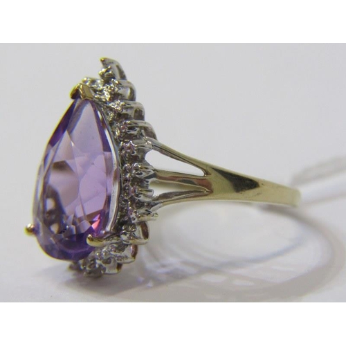 303 - AMETHYST CLUSTER RING, 9ct yellow gold ring, with a pear shaped amethyst in a cluster of diamonds, s... 