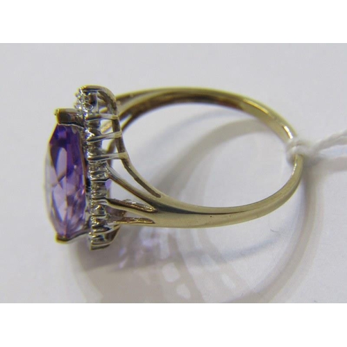 303 - AMETHYST CLUSTER RING, 9ct yellow gold ring, with a pear shaped amethyst in a cluster of diamonds, s... 