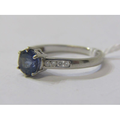 338 - DIAMOND & BLUE STONE DRESS RING, 9ct white gold ring, set with a central circular blue stone possibl... 