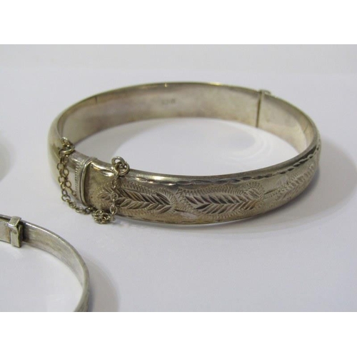 347 - SILVER BANGLES, hinged silver bangle with foliate decoration, an expanding silver bangle together wi... 