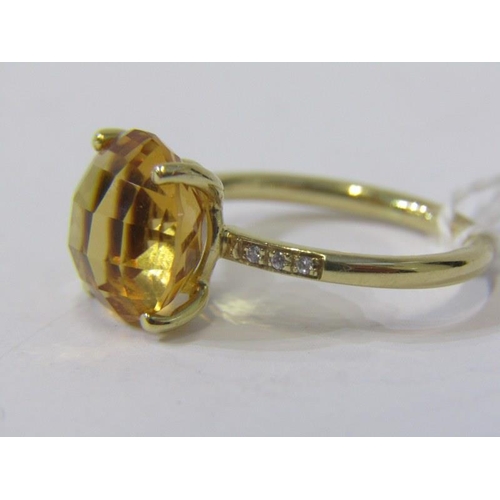 366 - CITRINE & DIAMOND RING, large circular citrine set on a yellow gold band with diamond shoulders, siz... 