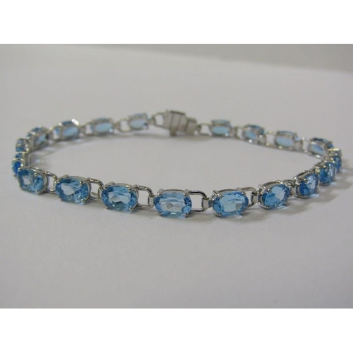 380 - QUALITY BLUE TOPAZ BRACELET, set in 18ct white gold, 7