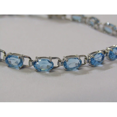 380 - QUALITY BLUE TOPAZ BRACELET, set in 18ct white gold, 7