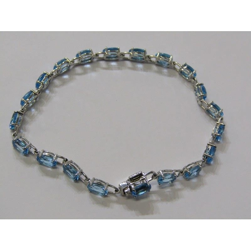 380 - QUALITY BLUE TOPAZ BRACELET, set in 18ct white gold, 7