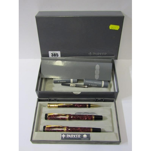 385 - IMPRESSIVE PARKER PEN SET, 3 piece Parker pen set with a mauve mottle case, fountain pen with 18ct g... 