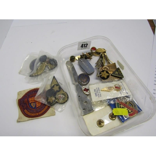 412 - ASSORTED BADGES, tin containing assorted gilt badges, cloth military badges, etc