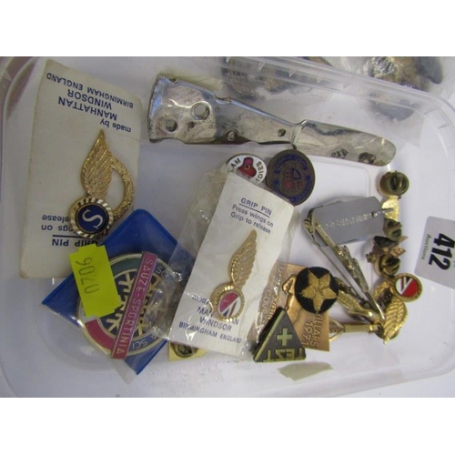 412 - ASSORTED BADGES, tin containing assorted gilt badges, cloth military badges, etc