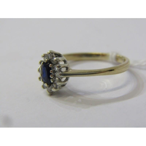 134 - 9ct YELLOW GOLD SAPPHIRE & DIAMOND CLUSTER RING, principal marquise cut sapphire surrounded by brill... 