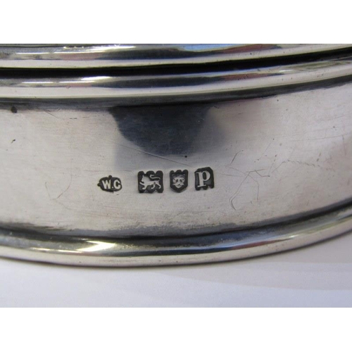 19 - SILVER RING BOX, of oval form with swag decoration to top, makers WC, London 1910, 11.5 cm diameter