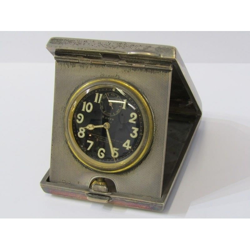 21 - ART DECO SILVER TRAVELLING CLOCK, the black dial 8 day clock by Goldsmith & Silversmith Co, in a HM ... 