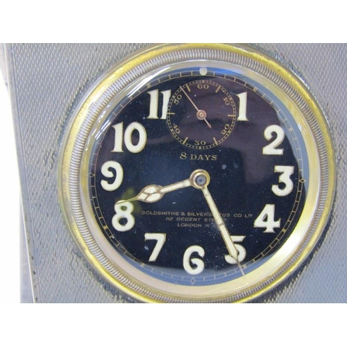 21 - ART DECO SILVER TRAVELLING CLOCK, the black dial 8 day clock by Goldsmith & Silversmith Co, in a HM ... 