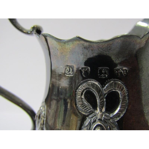 65 - GEORGIAN SILVER CREAM JUG,  with swag decoration on circular pedestal base maker possibly T W London... 