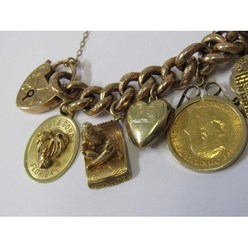 71 - CHARM BRACELET, 9ct gold charm bracelet with various charms to include half sovereign, opening house... 