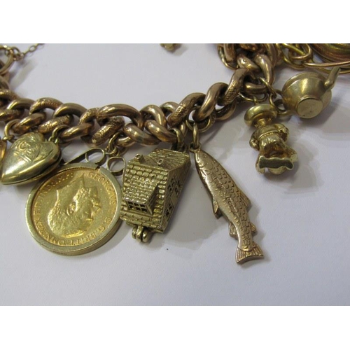 71 - CHARM BRACELET, 9ct gold charm bracelet with various charms to include half sovereign, opening house... 