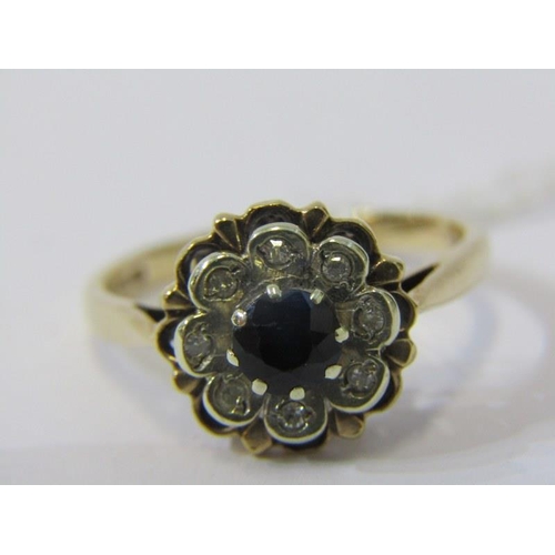 81 - 9ct YELLOW GOLD SAPPHIRE & DIAMOND FLOWER STYLE RING, principal brilliant cut sapphire surrounded by... 