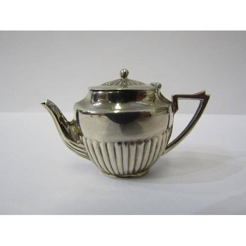 86 - MINIATURE SILVER TEA SET, tea pot, cream and sugar