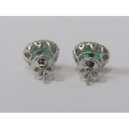 92 - PAIR OF 18ct WHITE GOLD EMERALD & DIAMOND CLUSTER EARRINGS, each earring has a principal oval cut em... 